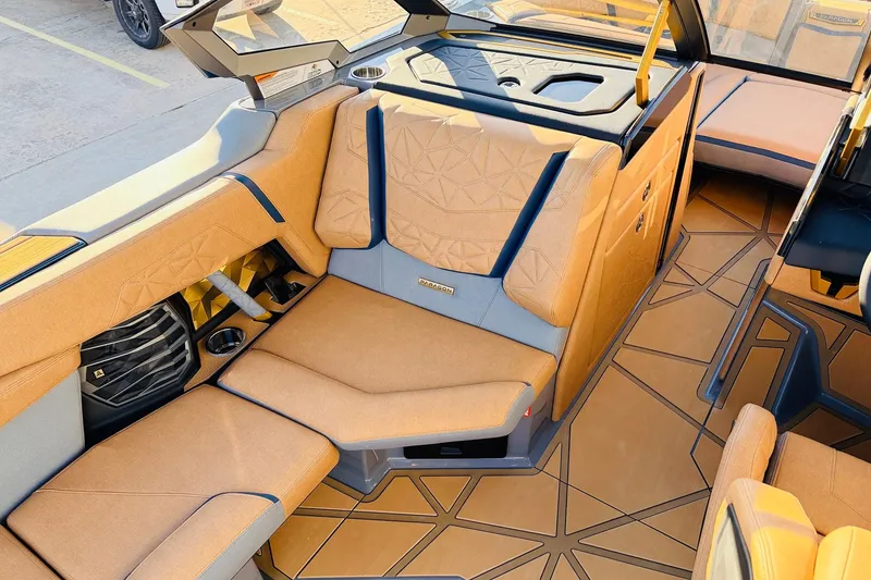Slide: The Image of Luxurious interior of 2026 Nautique Super Air Nautique G25 Paragon boat with tan seating. - 42