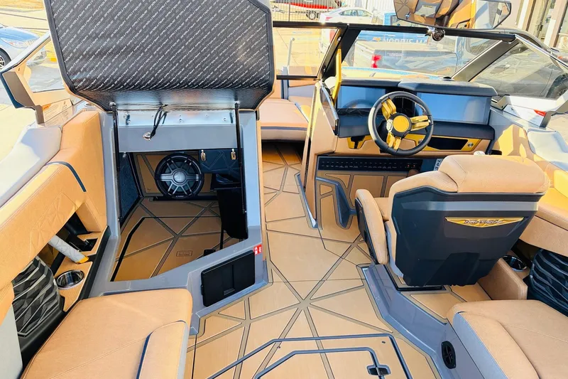 Slide: The Image of Interior of 2026 Nautique Super Air Nautique G25 Paragon boat, featuring luxurious seating and modern controls. - 43