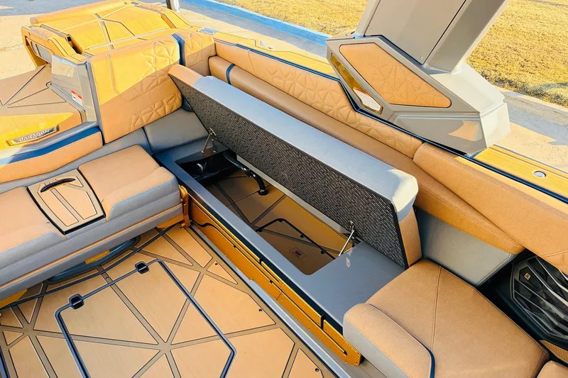 Slide: The Image of 2026 Nautique Super Air Nautique G25 Paragon interior with open storage compartment. - 48