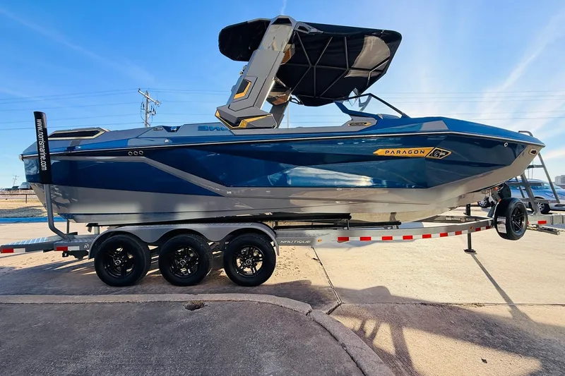 Slide: The Image of 2026 Nautique Super Air Nautique G25 Paragon boat on trailer, side view. - 5