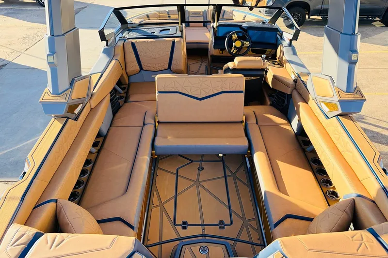 Slide: The Image of 2026 Nautique Super Air Nautique G25 Paragon interior with luxurious tan seating and modern design. - 58
