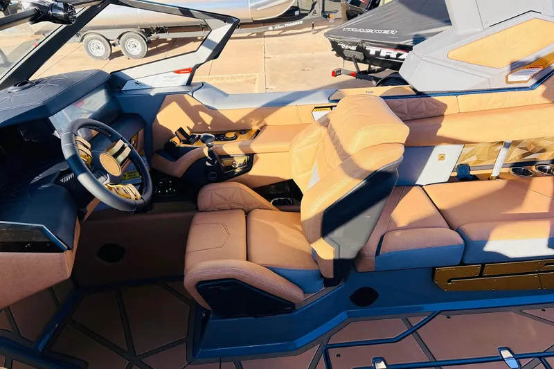 Slide: The Image of 2026 Nautique Super Air Nautique G25 Paragon interior with luxurious seating and modern dashboard. - 66