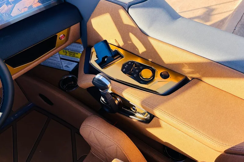 Slide: The Image of 2026 Nautique Super Air Nautique G25 Paragon interior with luxurious controls and modern design. - 76