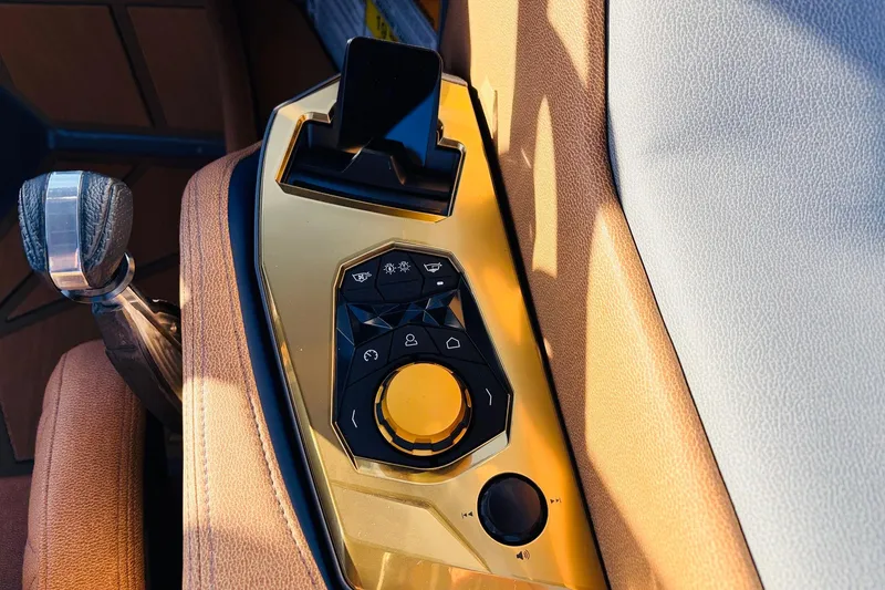 Slide: The Image of 2026 Nautique Super Air Nautique G25 Paragon control panel with sleek design and modern features. - 77
