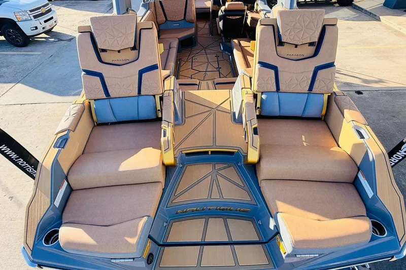 Slide: The Image of 2026 Nautique Super Air Nautique G25 Paragon boat interior with luxurious seating and modern design. - 79