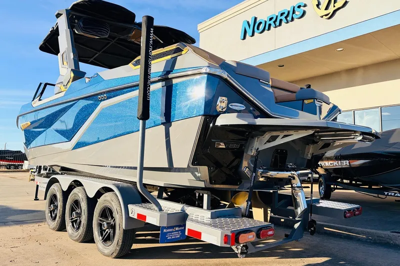 Slide: The Image of 2026 Nautique Super Air Nautique G25 Paragon boat on trailer at dealership. - 8