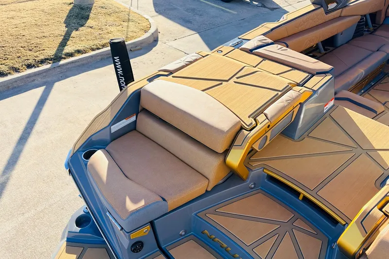 Slide: The Image of 2026 Nautique Super Air Nautique G25 Paragon boat interior with luxurious seating and deck design. - 84