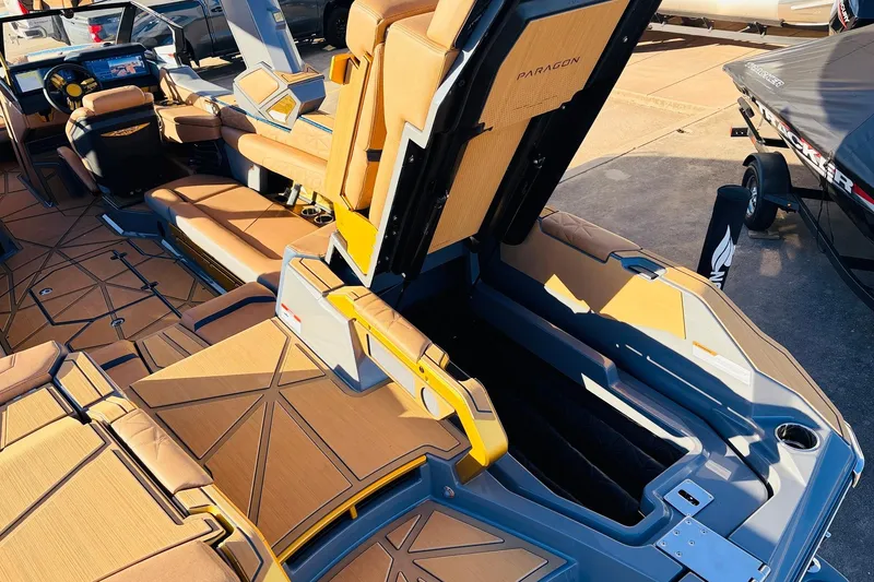 Slide: The Image of 2026 Nautique Super Air Nautique G25 Paragon interior with luxurious seating and storage. - 87