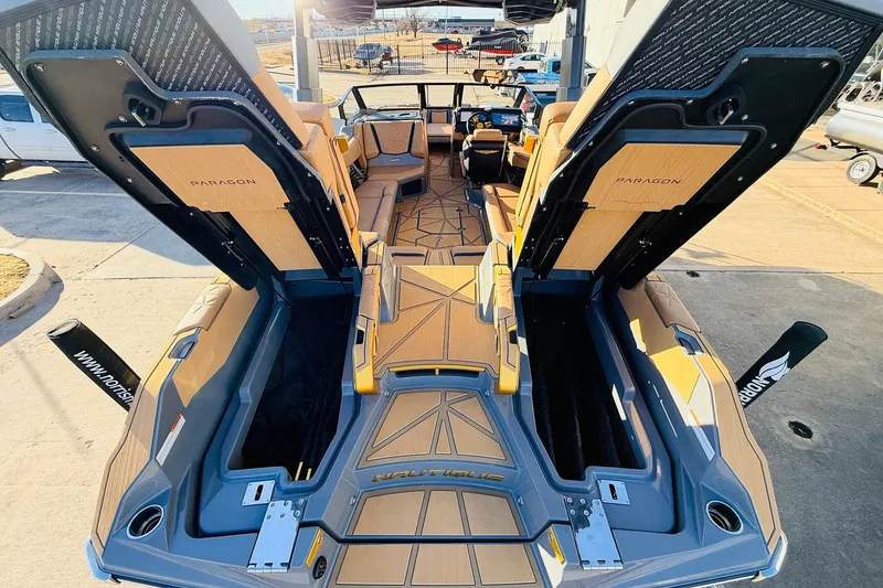 Slide: The Image of 2026 Nautique Super Air Nautique G25 Paragon boat interior with open storage compartments. - 88