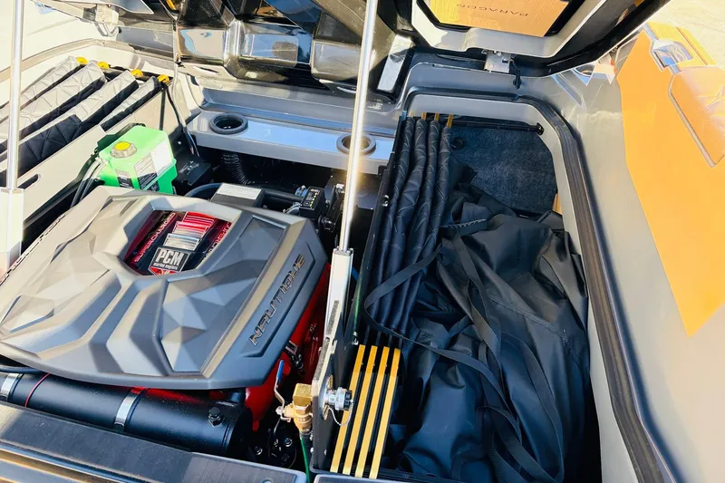 Slide: The Image of 2026 Nautique Super Air Nautique G25 Paragon engine compartment with PCM engine and storage. - 92