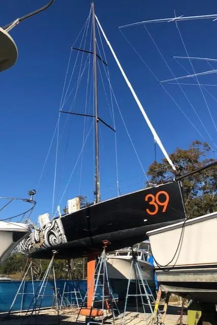 Slide: The Image of 2007 Akilaria MK1 Class 40 sailboat on stands in harbor. - 11