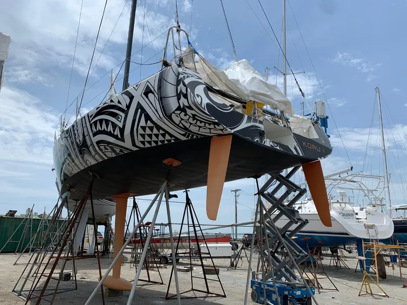 Slide: The Image of 2007 Akilaria MK1 Class 40 yacht in dry dock with tribal design. - 5