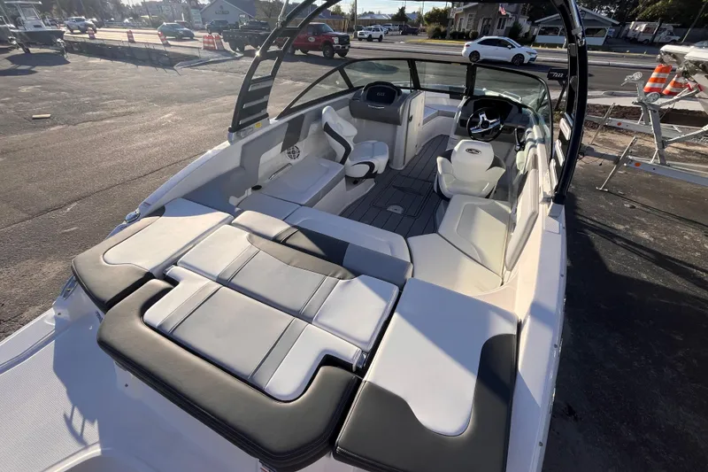 Slide: The Image of 2025 Chaparral 23 SSi OB boat interior with sleek seating and modern dashboard design. - 4