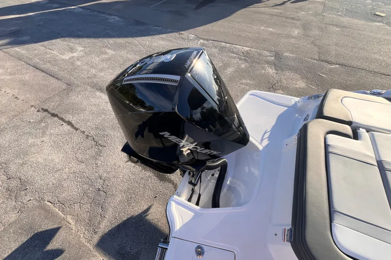 Slide: The Image of 2025 Chaparral 23 SSi OB boat with Mercury outboard engine, rear view. - 5