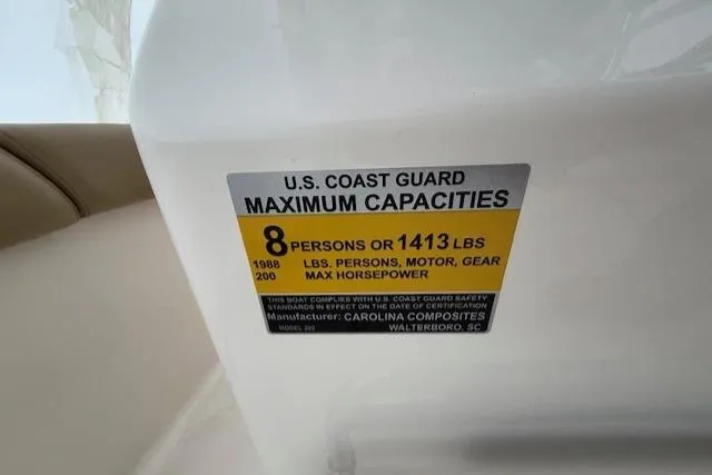 Slide: The Image of U.S. Coast Guard capacity label on 2020 Pioneer 202 Islander boat, 8 persons or 1413 lbs. - 14