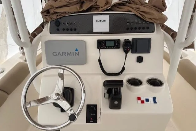 Slide: The Image of 2020 Pioneer 202 Islander boat console with Garmin navigation and Suzuki controls. - 4