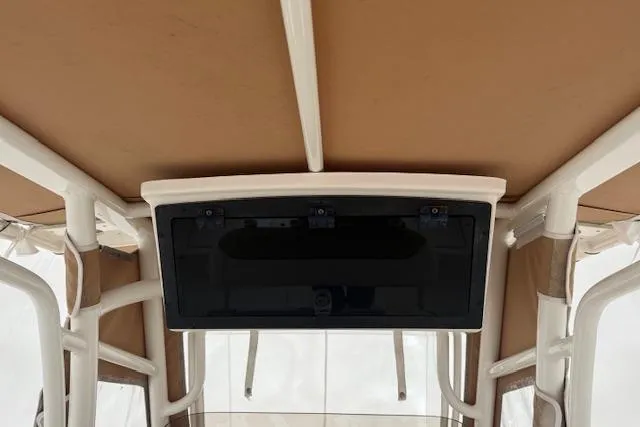 Slide: The Image of 2020 Pioneer 202 Islander boat interior with beige canopy and white frame. - 5
