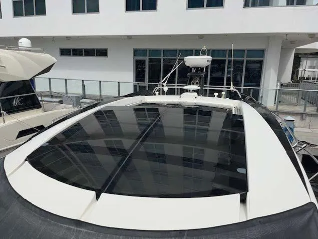 Slide: The Image of 2008 Marquis 40 SC yacht with sleek design and tinted windows. - 15