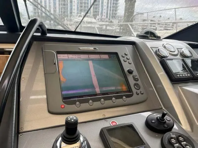 Slide: The Image of Control panel of a 2008 Marquis 40 SC yacht with navigation display. - 18
