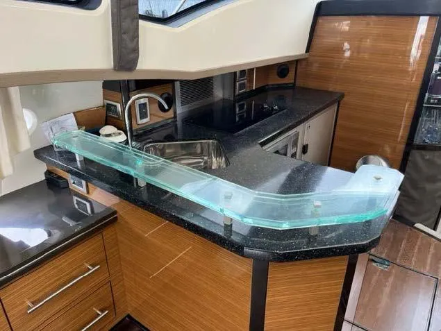 Slide: The Image of Modern kitchen area in a 2008 Marquis 40 SC yacht with sleek countertops. - 2