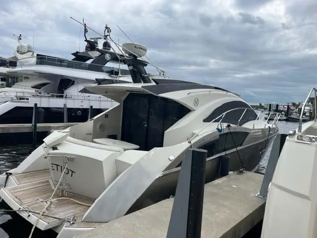 Slide: The Image of 2008 Marquis 40 SC luxury yacht docked at marina. - 21