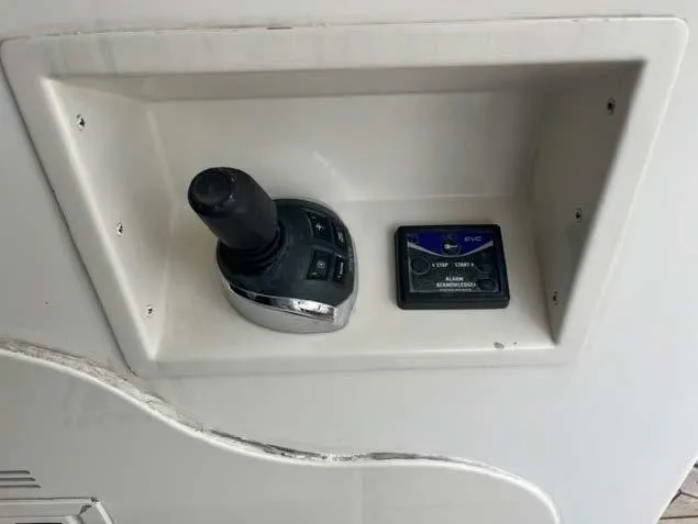 Slide: The Image of Control panel of a 2008 Marquis 40 SC yacht with joystick and display. - 23