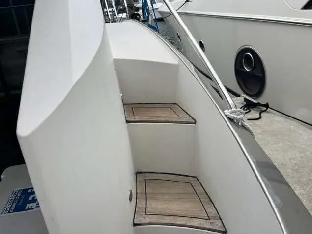 Slide: The Image of Steps on the deck of a 2008 Marquis 40 SC yacht. - 24