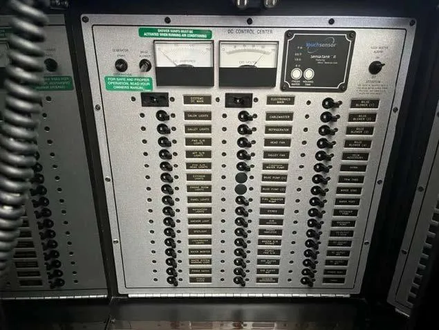 Slide: The Image of 2008 Marquis 40 SC DC control center panel with switches and meters. - 28