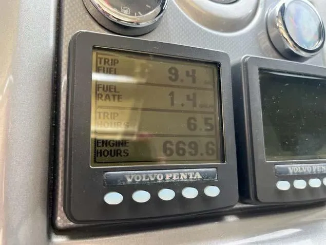 Slide: The Image of Volvo Penta engine display on 2008 Marquis 40 SC showing trip fuel, fuel rate, trip hours, and engine hours. - 30