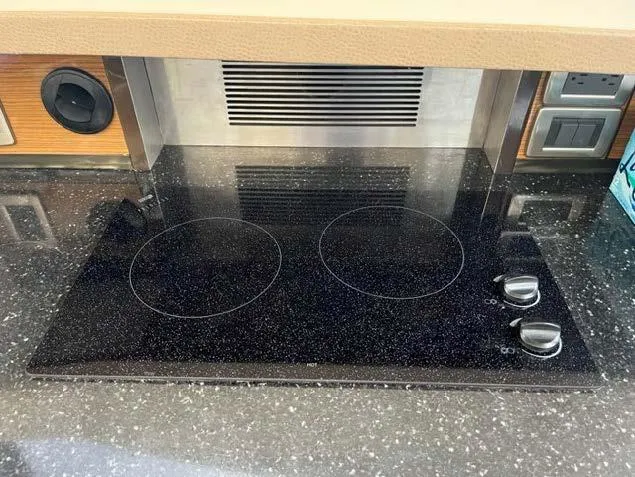 Slide: The Image of 2008 Marquis 40 SC yacht kitchen with electric stovetop and modern appliances. - 39