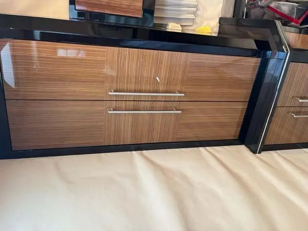 Slide: The Image of 2008 Marquis 40 SC interior cabinetry with wood finish and sleek handles. - 48