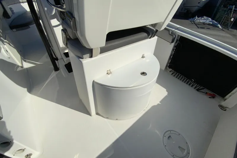 Slide: The Image of 2020 Aquasport 2500 Center Console boat interior with seating and storage. - 19