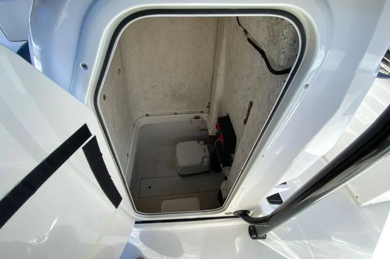 Slide: The Image of 2020 Aquasport 2500 Center Console storage compartment interior view. - 27