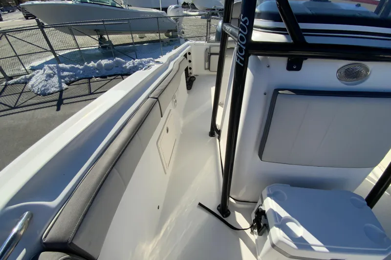 Slide: The Image of 2020 Aquasport 2500 Center Console boat interior with seating and storage. - 33