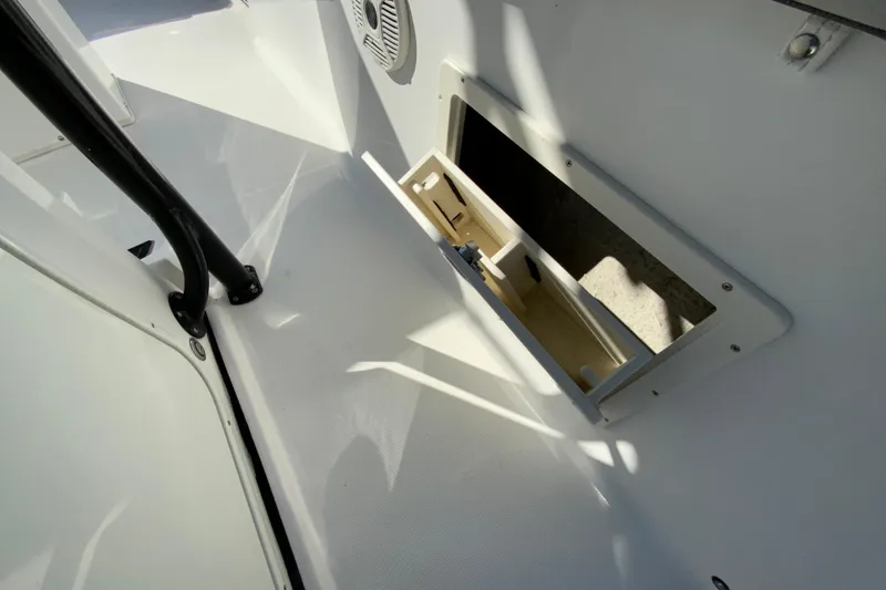 Slide: The Image of 2020 Aquasport 2500 Center Console interior storage compartment detail. - 35