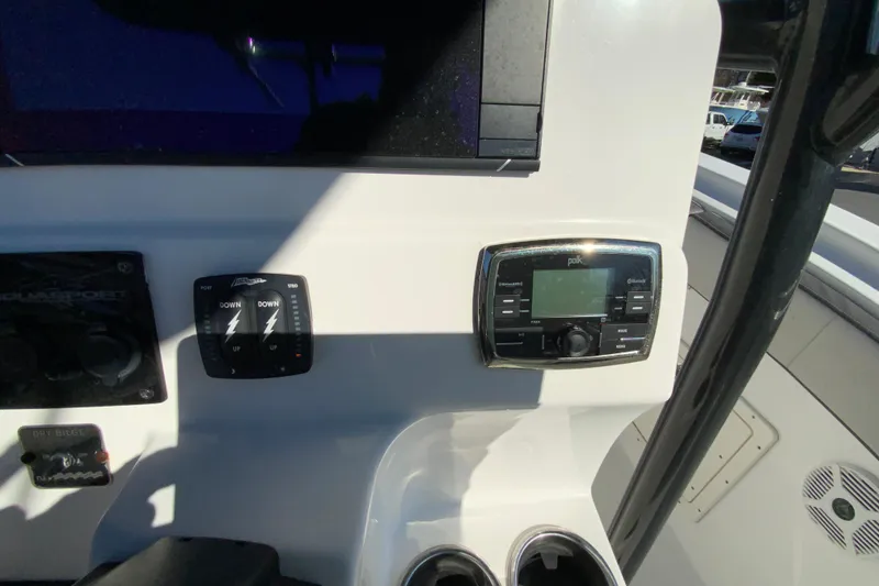 Slide: The Image of 2020 Aquasport 2500 Center Console dashboard with controls and Polk audio system. - 37