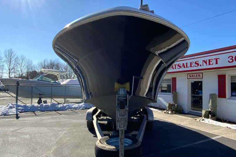 Slide: The Image of 2020 Aquasport 2500 Center Console boat on trailer, parked outside dealership. - 4