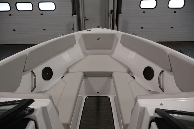 Slide: The Image of 2026 Four Winns H4 Freedom boat interior with cushioned seating and speakers. - 10