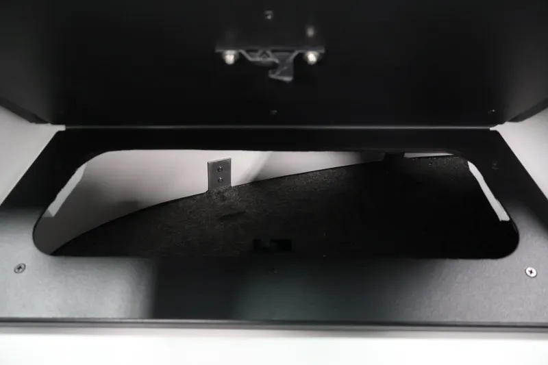 Slide: The Image of Storage compartment of 2026 Four Winns H4 Freedom boat, featuring a sleek black interior. - 27