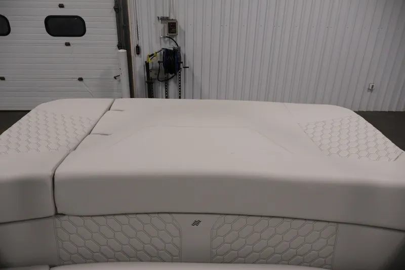Slide: The Image of 2026 Four Winns H4 Freedom boat interior with white cushioned seating. - 31