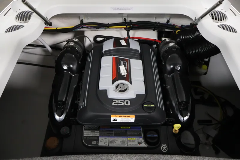 Slide: The Image of Engine compartment of 2026 Four Winns H4 Freedom boat, featuring a powerful 250 HP engine. - 32