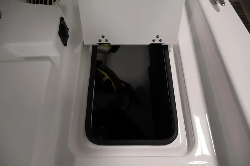 Slide: The Image of Storage compartment on 2026 Four Winns H4 Freedom boat, featuring sleek white design. - 33