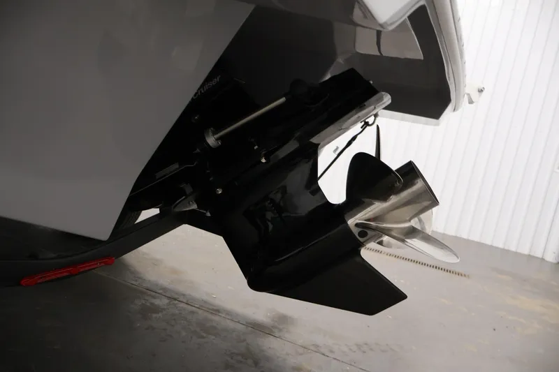 Slide: The Image of 2026 Four Winns H4 Freedom boat propeller and stern detail in a garage. - 36