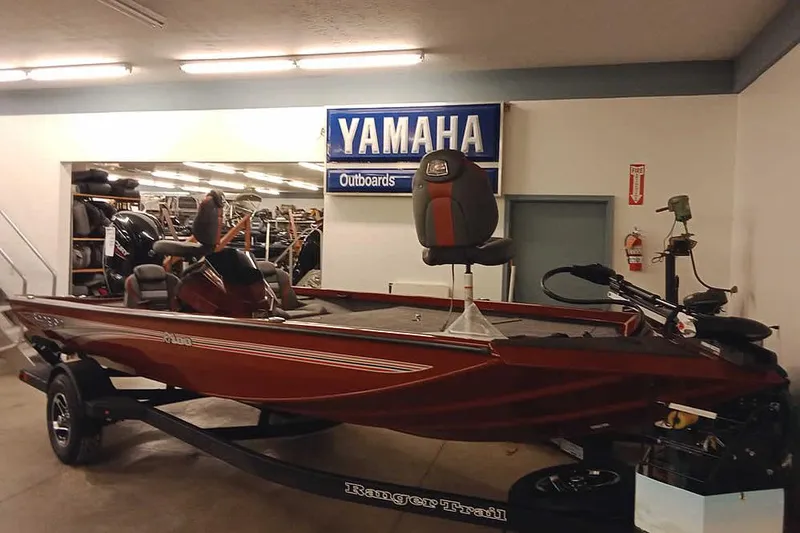 The Image of 2026 Ranger RT188 boat displayed indoors with Yamaha outboard sign. - 0