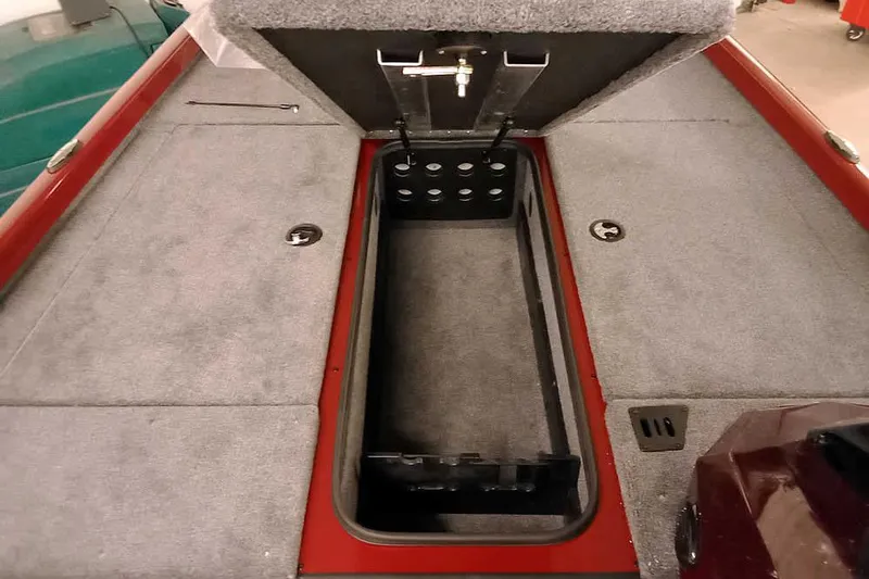 Slide: The Image of 2026 Ranger RT188 boat storage compartment with open lid, showcasing spacious interior. - 10