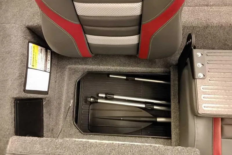 Slide: The Image of 2026 Ranger RT188 boat interior storage with paddle and seat details. - 18