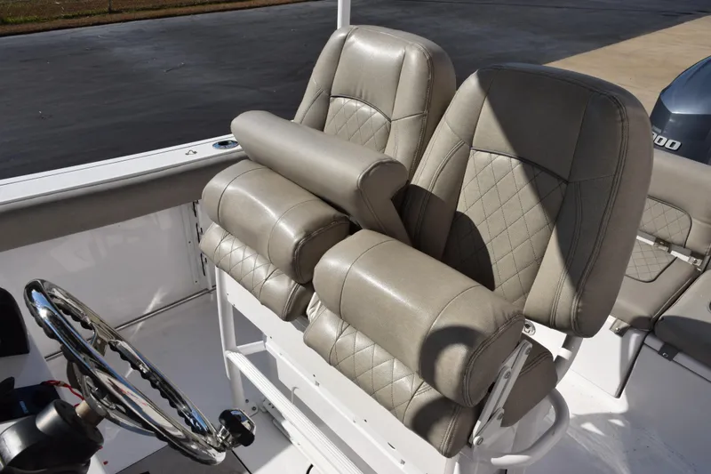 Slide: The Image of 2021 Sportsman Heritage 241 Center Console boat seats with diamond-stitched upholstery. - 10