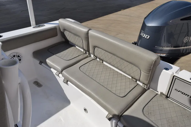 Slide: The Image of 2021 Sportsman Heritage 241 Center Console boat with cushioned seating and Yamaha 300 engine. - 11