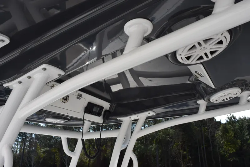 Slide: The Image of 2021 Sportsman Heritage 241 Center Console T-top with speakers and radio equipment. - 12