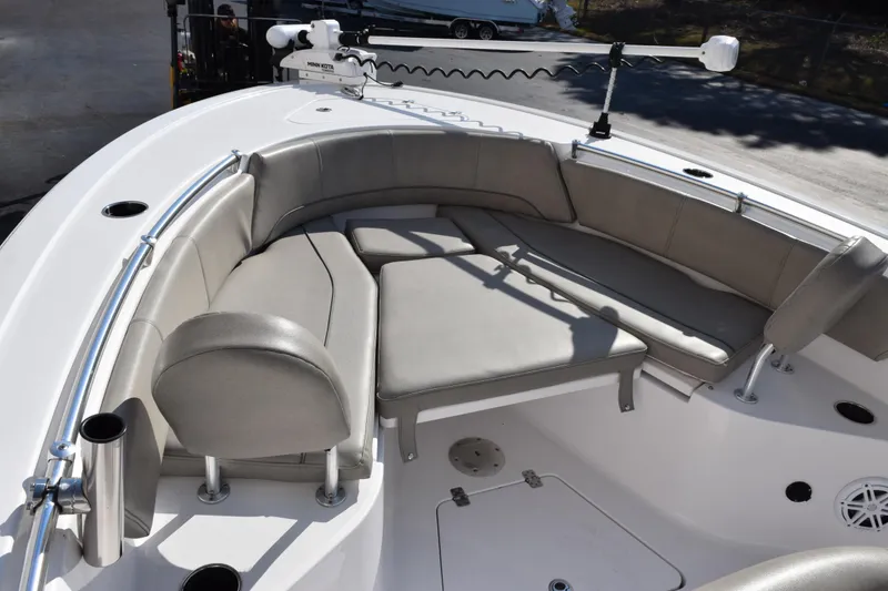Slide: The Image of 2021 Sportsman Heritage 241 Center Console boat with cushioned seating area. - 13